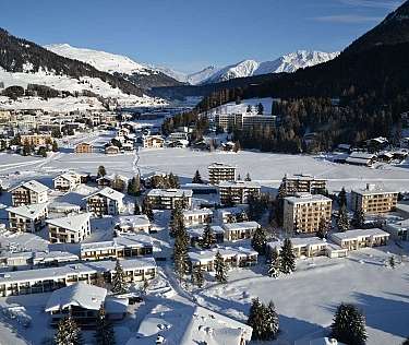 Snowy Mountain Village Aerial view of a snow-covered village in the mountains.